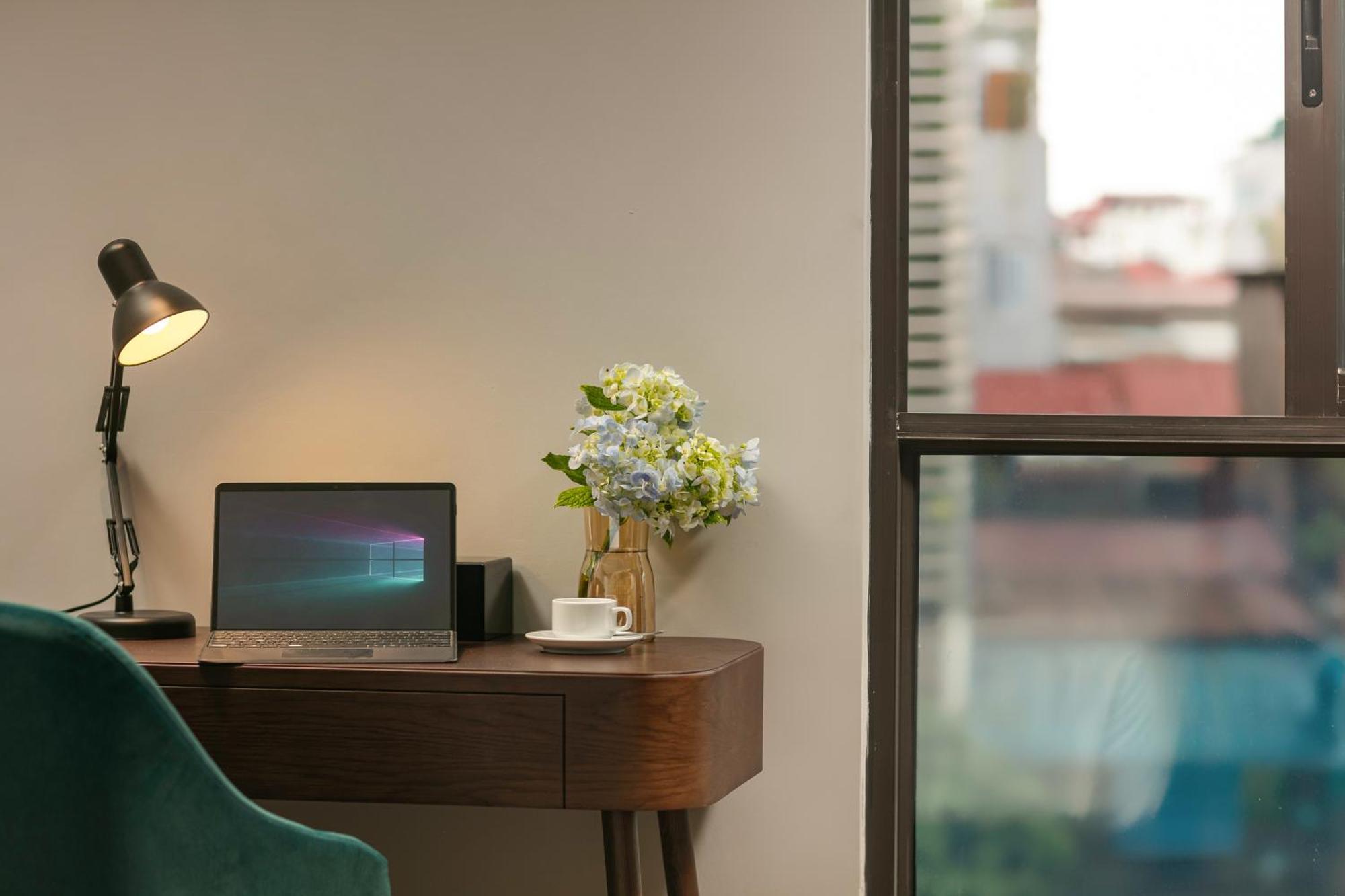 May De Ville Lakeside Hotel Hanoi Bagian luar foto A Microsoft Surface Pro 4
